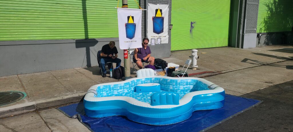 The Yellow and Black Group Piss Pool at 2023 Folsom Street Fair